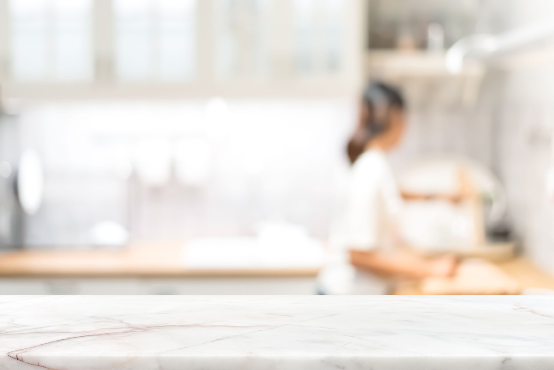 Marble stone countertop on blur kitchen interior background